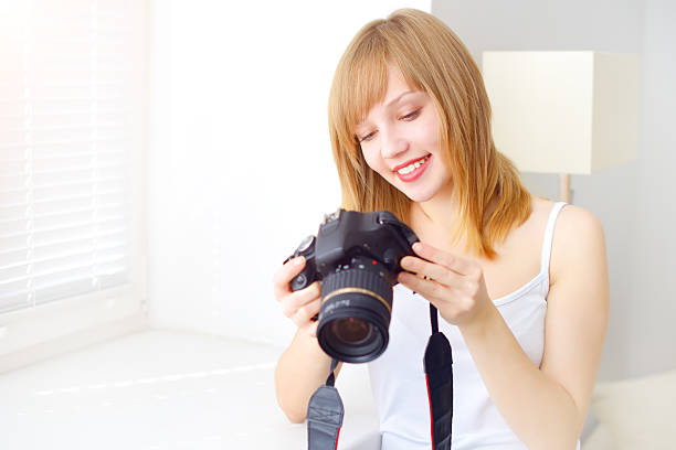istock Teenage girl with digital camera 179059581