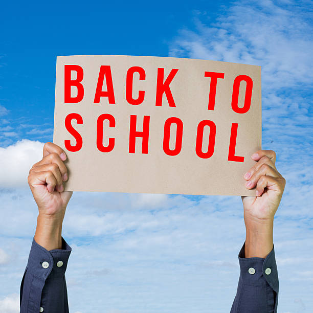 istock Hands holding brown paper with back to school 179059942