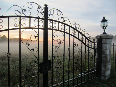 Morning Fog and Sunrise Seen Through Iron Gate