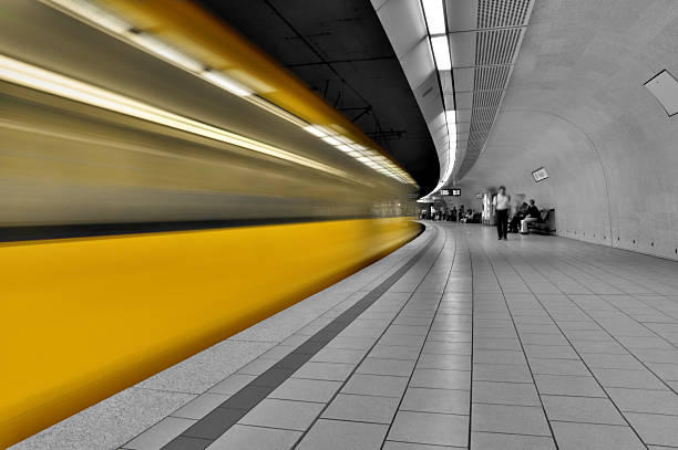 istock Grey subway station with bright yellow time lapse of train 179060345