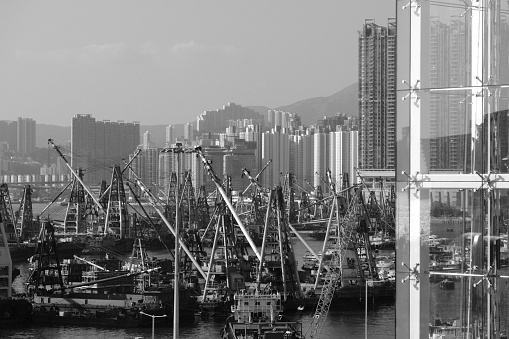 Cranes at Hong Kong harbor in West Kowloon Hong Kong.,