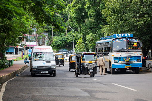 Port Blair, India - October 10, 2023. Vehicles on the road of the main port in the Andaman Islands, near the Cellular Jail.