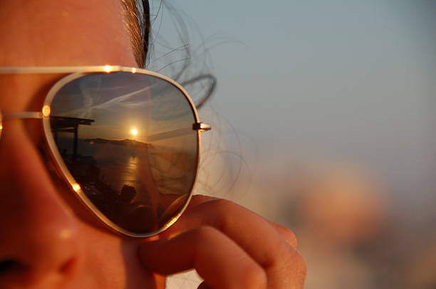 Girl shooting backlit Looking through solar glasses,Shooting backlit ,Lighting with sun flare