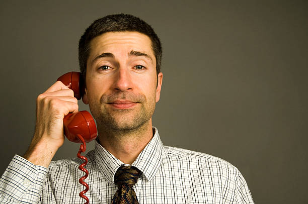 istock Confident Business Man on Red Telephone 179062349