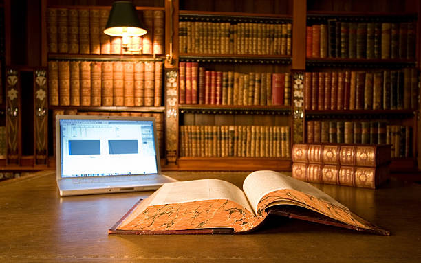 Turn on laptop in old library stock photo
