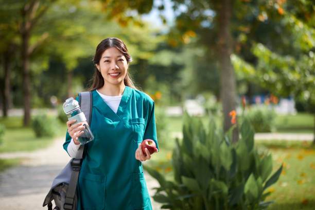 Medical Nurse Spending Lunch in Park