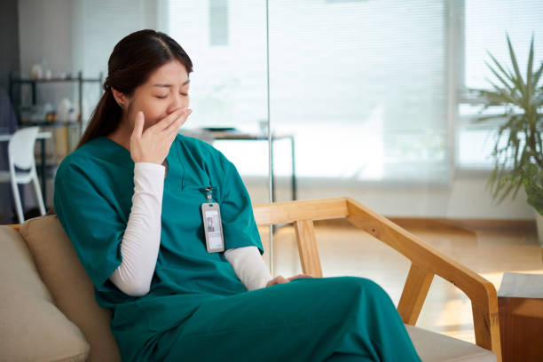 istock Tired Medical Nurse Yawning 1790631248