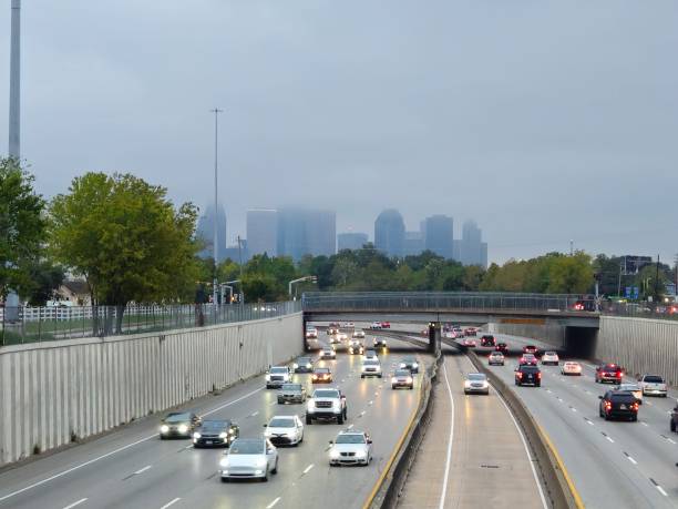istock Traffic On Highway And Downtown Houston Skyline Surrounded By Clouds 1790631263