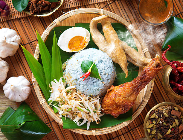 Nasi kerabu Nasi kerabu is a type of nasi ulam, popular Malay rice dish. Blue color of rice resulting from the petals of  butterfly-pea flowers. Traditional Malaysian food, Asian cuisine. terengganu stock pictures, royalty-free photos & images