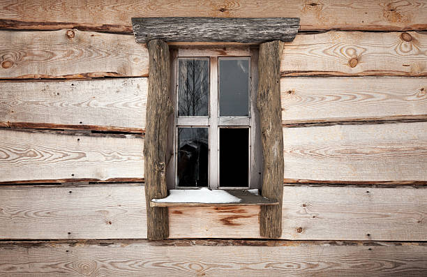 istock Old wooden building facade texture with small window 179065771