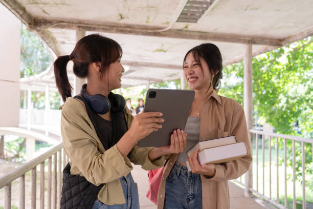 istock Two college student female friends smile ready for class at the university campus 1790661963