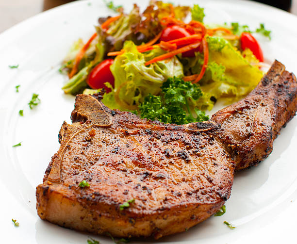 istock Pork chop with salad close up 179067137