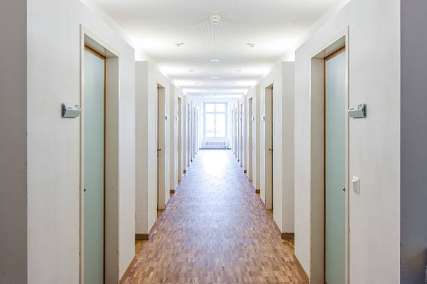istock Door rooms in dorm and windows at the end 179067141