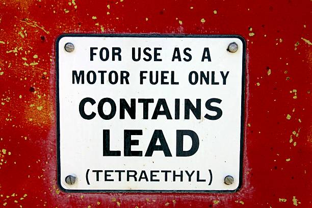 1970's sign on  red /yellow gas pump showing it is leaded gas.  White sign with black lettering secured with silver screws.For use as a motor fuel only.  Contains Lead ( tetraethyl )Leaded Fuel