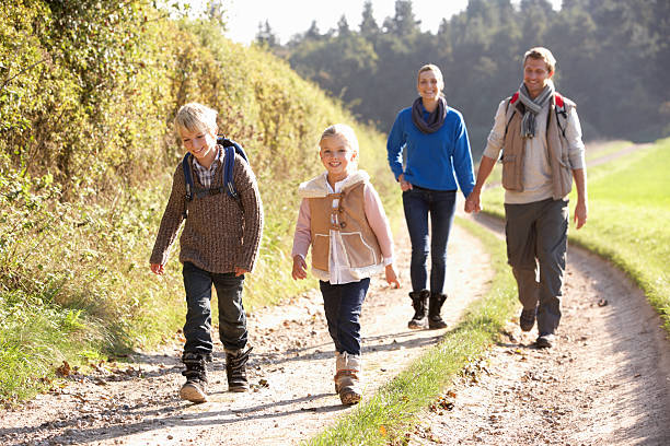 istock Young family walking in park 179067598