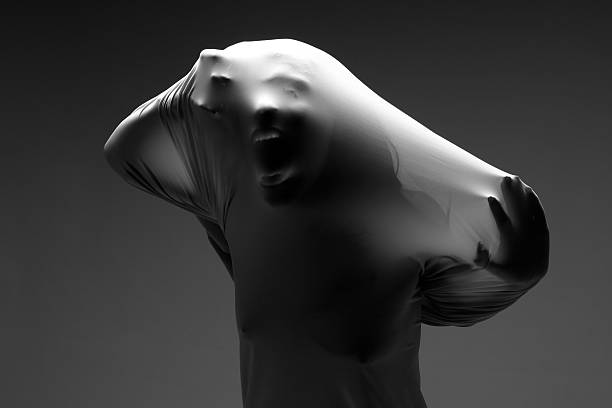 istock Screaming Woman Trapped in Fabric 179068578