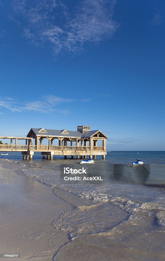 Beach with Rental Jet Skis Small pier with jet skis. After Work Stock Photo