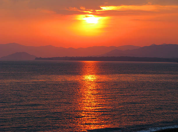 istock pink sunset in mediterranean sea 179069010