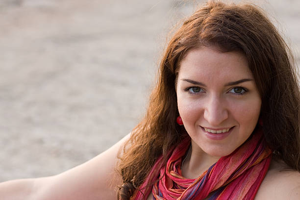 Young woman smiling into the camera stock photo