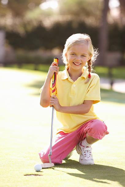 istock Young Girl Practising Golf On Putting Green 179069546