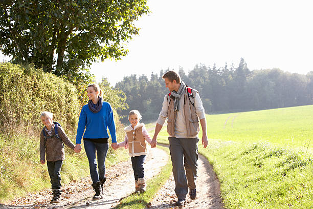 istock Young family walking in park 179070297