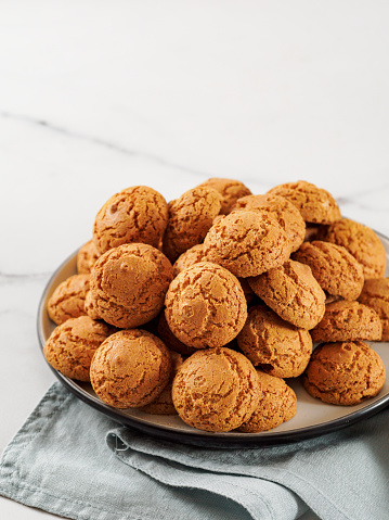 Plate of cookie amaretti on white marble