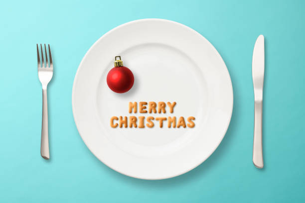 Tableware set for christmas - set of plates, cups and utencils with golden chrismas decorations
