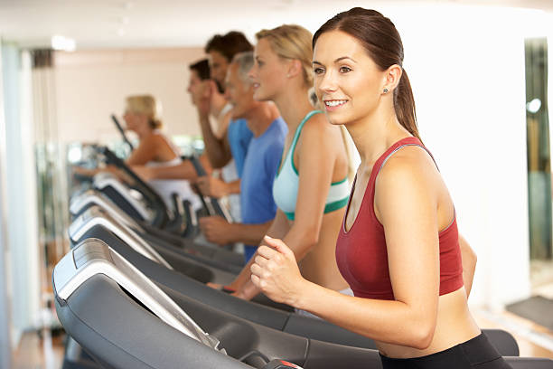 istock Group of fit people training on treadmills at a gym 179071024