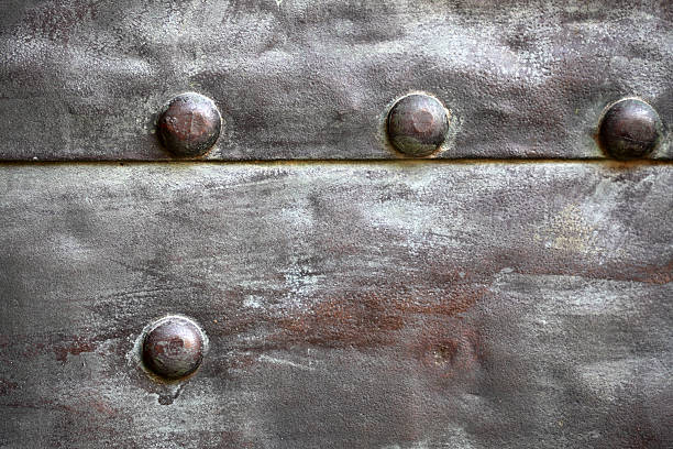 istock Black metal plate or armour texture with rivets 179071152