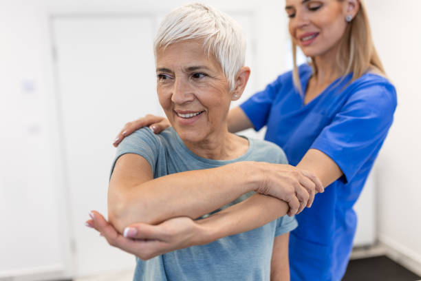 istock Professional therapists is stretching muscles, senior patient with abnormal muscular symptoms, physical rehabilitation therapies and treatment of physiological disorders by physiotherapists concept. 1790718096