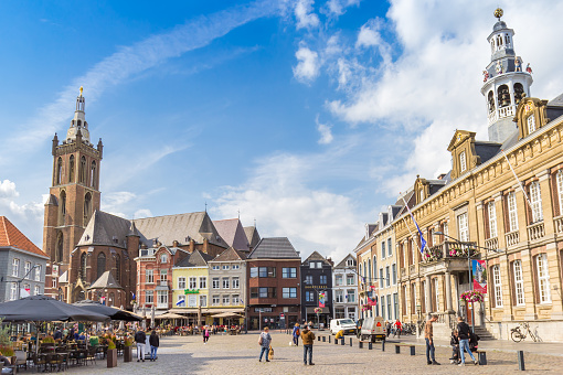Roermond, Netherlands - August 08, 2023: Town hall and cathedral on the market square in Roermond, Netherlands
