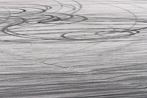 istock Skidding cars marks 179072440