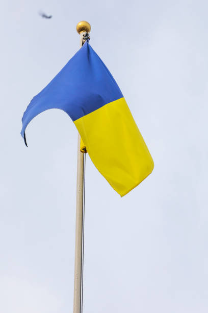 istock Ukrainian flag on a flagpole against a cloudy sky, with a focus on support and the challenges 1790726201