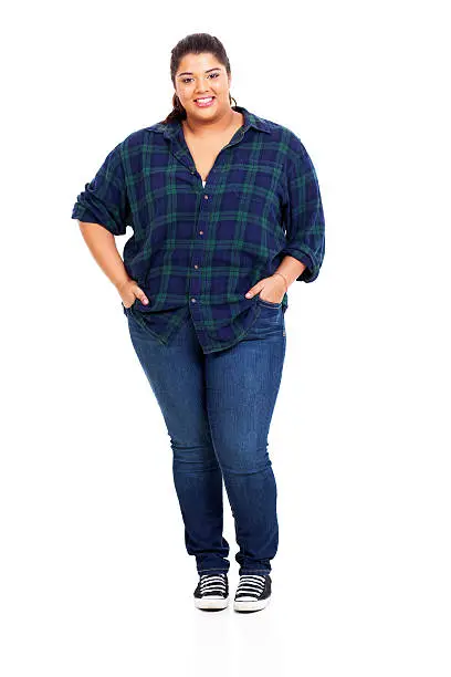 beautiful large woman in jeans isolated on white background