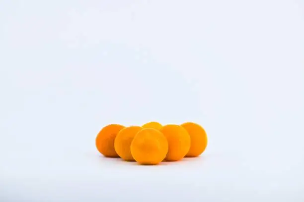 A delightful composition capturing the freshness of mandarins against a clean white backdrop.