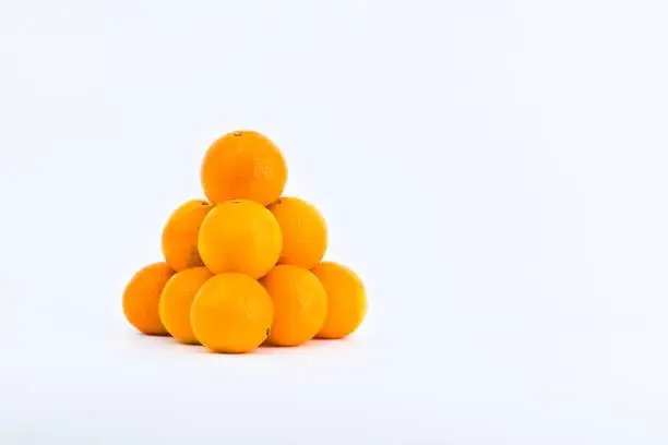 A delightful composition capturing the freshness of mandarins against a clean white backdrop.