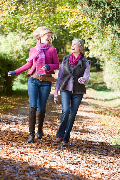 istock Mother and daughter on walk through woods 179073096