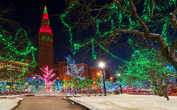 Cleveland Christmas The Terminal Tower and Public Square in Cleveland Ohio colorfully lit up for Christmas terminal tower stock pictures, royalty-free photos & images