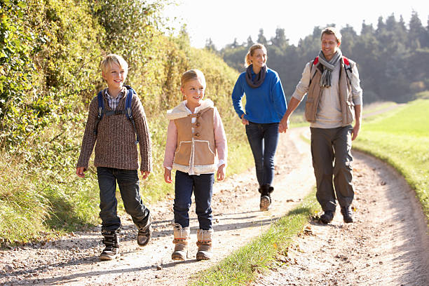 istock Young family walking in park 179073670