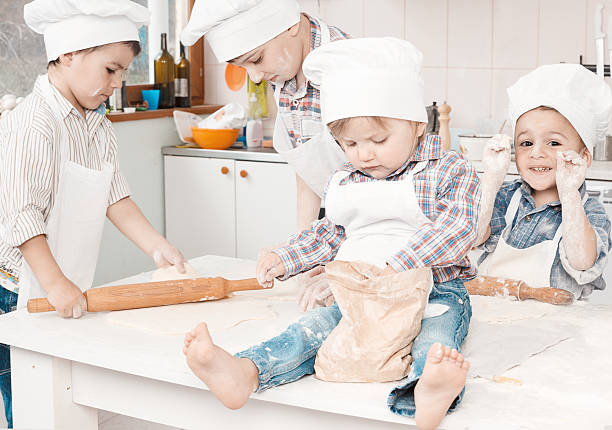 istock happy little chefs preparing dough in the kitchen 179073749
