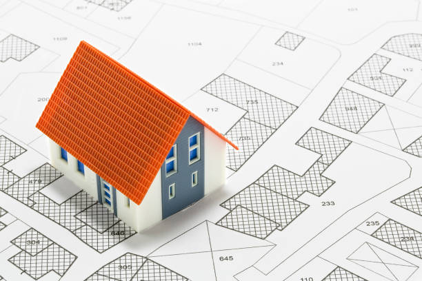 istock Cadastral map with buildings, building plot and free land parcel for house construction - building activity and permit concept with home model 1790740567