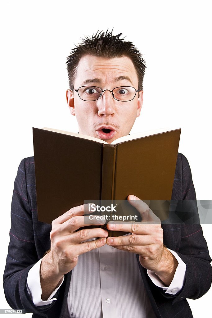 Shocking! "A dapper dude reading from a book, seemingly shocked or surprised by what it says." Book Stock Photo