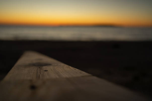 istock Wooden Surface for Placing an Object, Mock-Up, with Selective Focus and a Blurred Sunset in the Background 1790743494