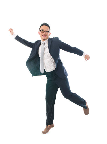 istock asian business jumping in joy 179074388
