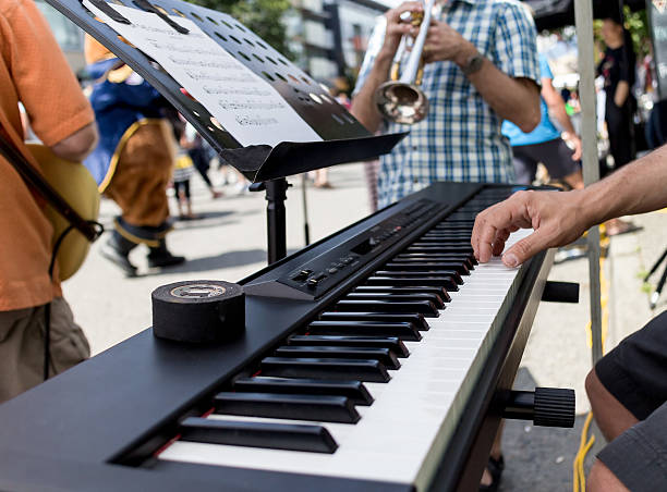 istock groovy playing piano at outdoor fest 179074417