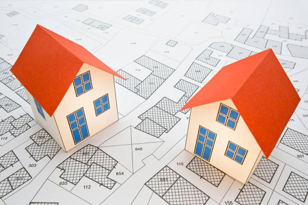 istock Cadastral map with buildings, building plot and free land parcel for house construction - building activity and permit concept with home model 1790746354