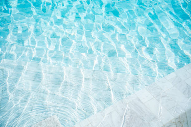 istock Transparent blue clear water surface texture in the pool. 1790747394