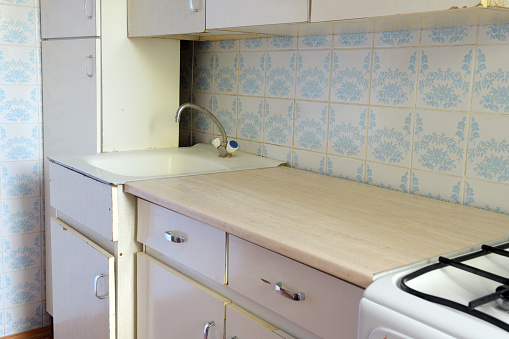 Vintage retro kitchen with blue patterned tiles, retro kitchen, 70s style home interior design.