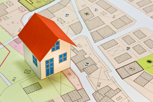 istock New home and free vacant land for building activity - Construction industry and building permit concept with a residential area, cadastral map, General Urban Planning and zoning regulations 1790751666