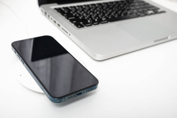 istock Charging smartphone battery with wireless charger device 1790761390